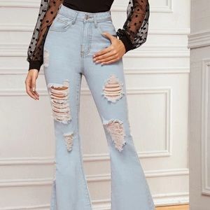 Distressed flared blue jeans